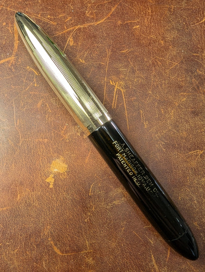 1942 Black Sheaffer Triumph Tuckaway Crest - medium+ point