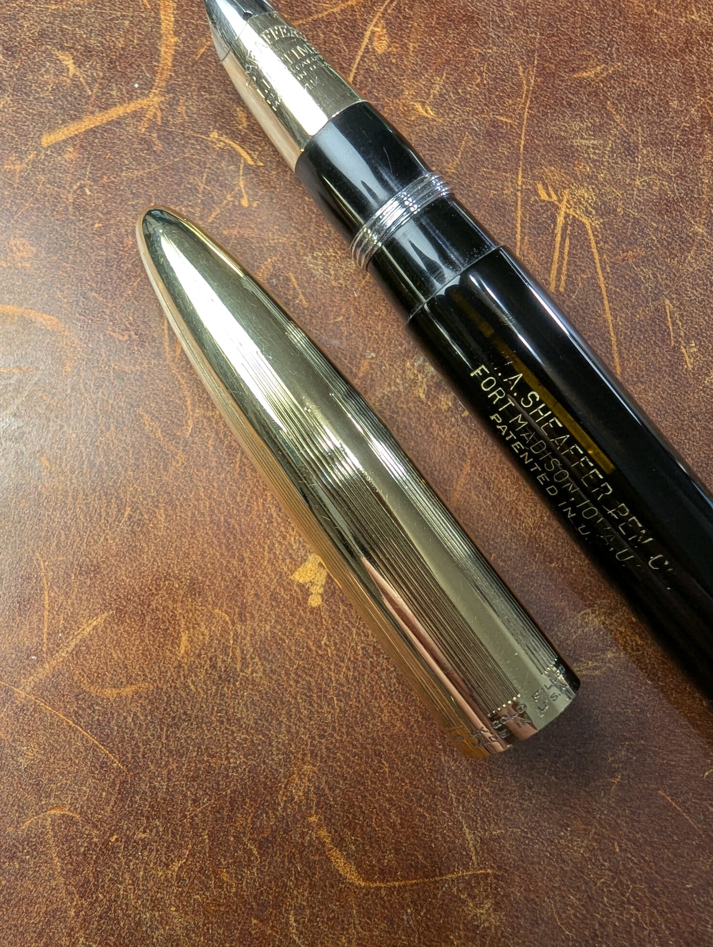 1942 Black Sheaffer Triumph Tuckaway Crest - medium+ point