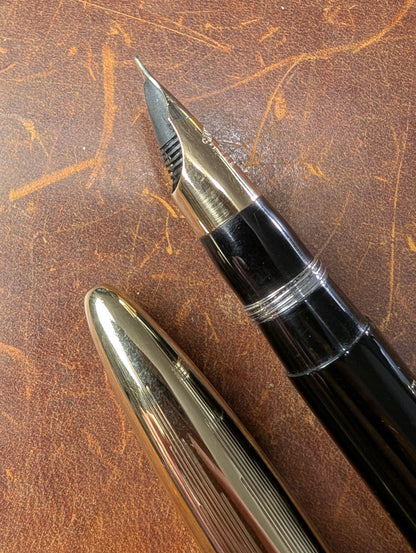 1942 Black Sheaffer Triumph Tuckaway Crest - medium+ point