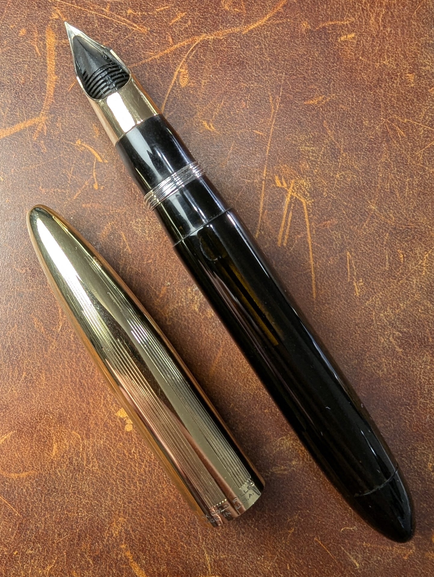 1942 Black Sheaffer Triumph Tuckaway Crest - medium+ point
