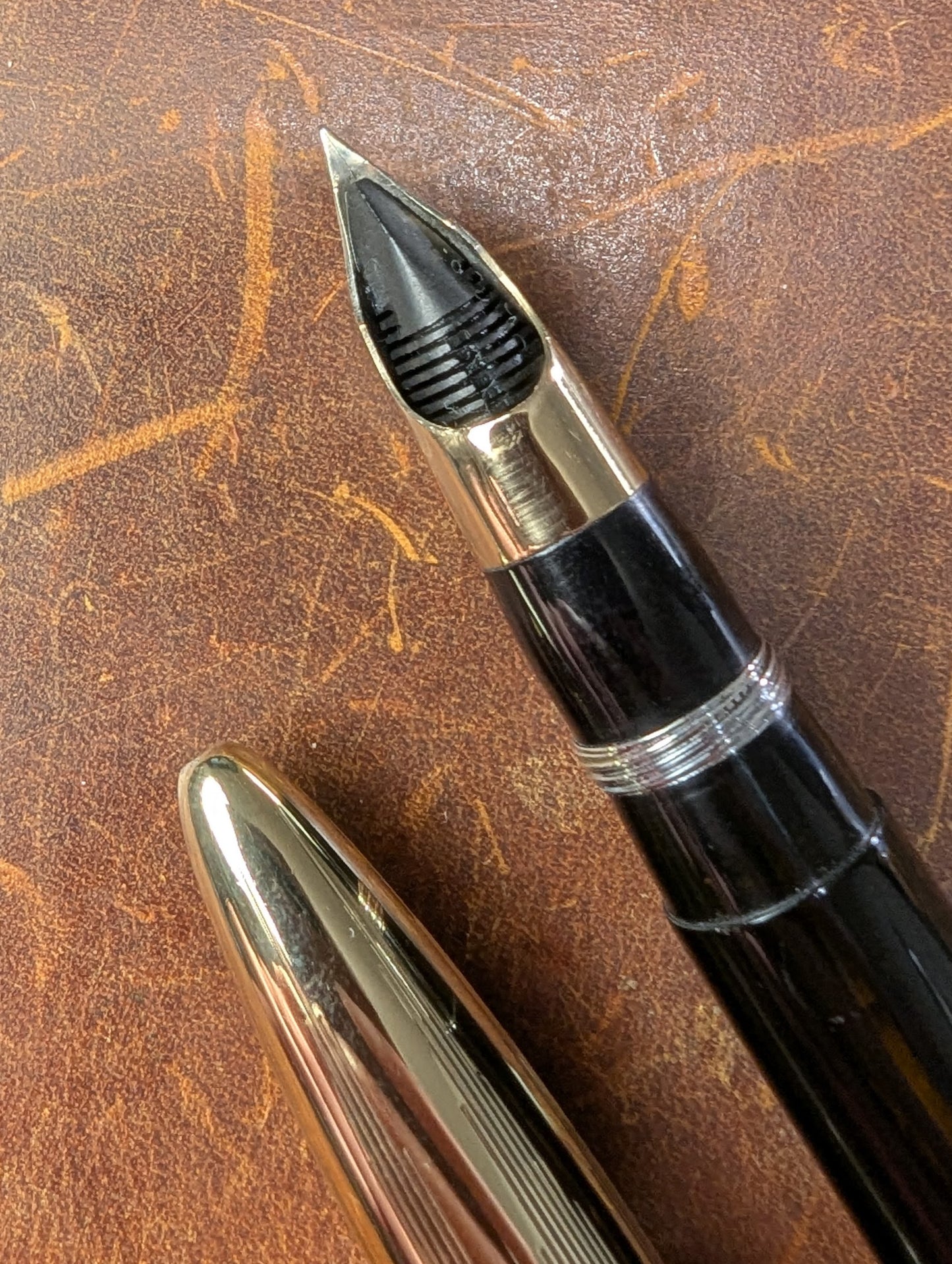 1942 Black Sheaffer Triumph Tuckaway Crest - medium+ point